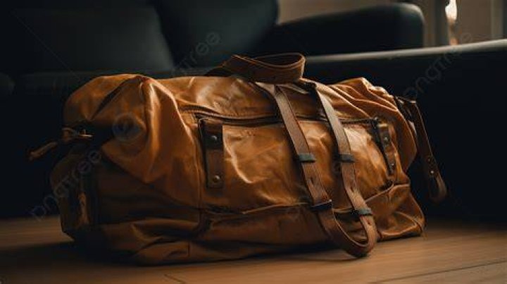 Duffel bag sitting in the middle of a road