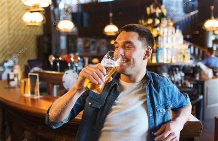Man drinking pint of beer man drinking pint of beer