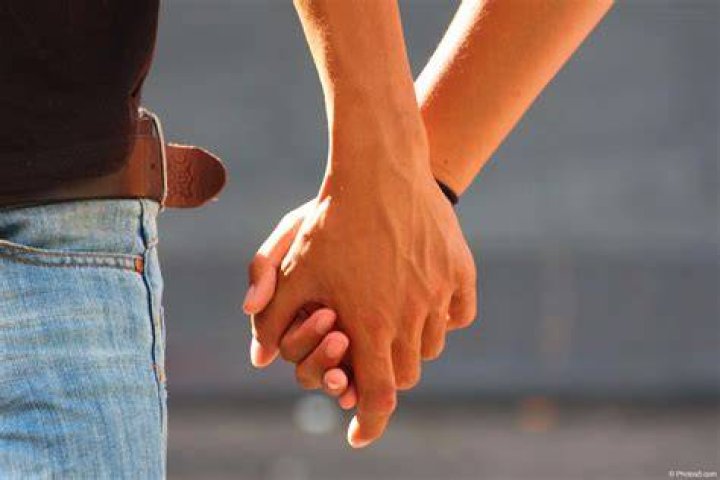 Testicular cancer man hands holding on middle crotch of trousers with pain action isolated on white background