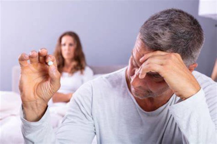 Man having erectile problem in bedroom man having erectile problem in bedroom