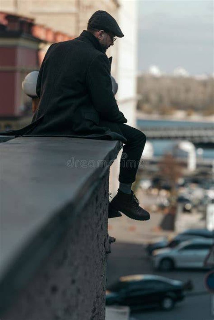 Men sitting in urban roof garden laughing. men sitting in urban roof garden laughing