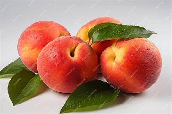 Ripe fresh peach fruits whole on white. Harvesting, healthy food, fresh fruit concept ripe fresh peach fruits whole on white