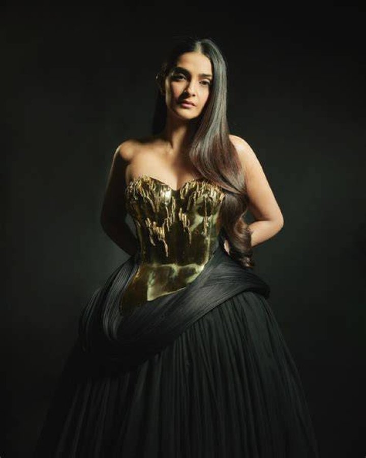 Sonam Kapoor slays in an asymmetrical formal attire as she poses with Anand Ahuja