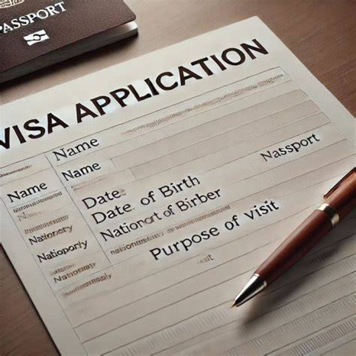 visa application sitting on a black table next to a model airplane