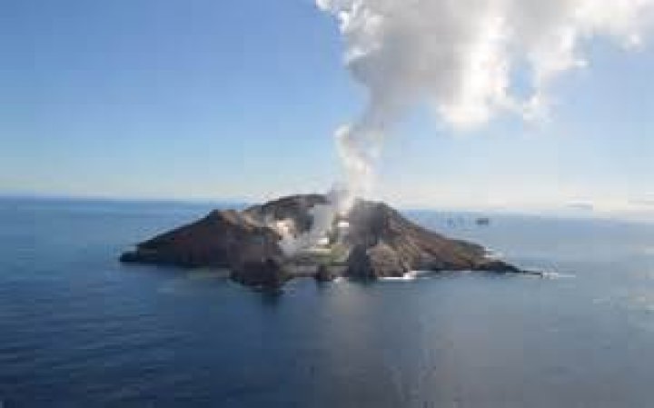 White Island's main crater was left caked in erupted ash and debris after a pyroclastic surge swept through it. Photo / Auckland Rescue Helicopter Service